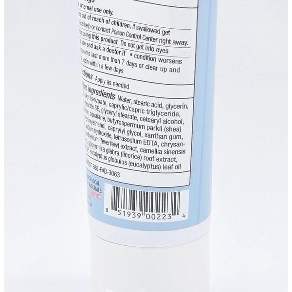 Close-up of First Aid Beauty Ultra Repair Cream bottle, showing ingredients list and barcode on white label.