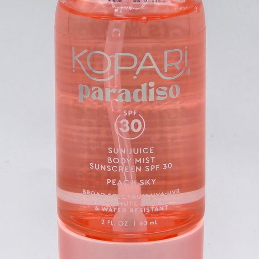 Kopari Paradiso Sun Juice Body Mist SPF 30, 2 fl oz, with peach-tinted liquid in a clear bottle.