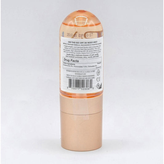 Kopari Paradiso Sun Juice Body Mist SPF 30, orange bottle with label and gold base.