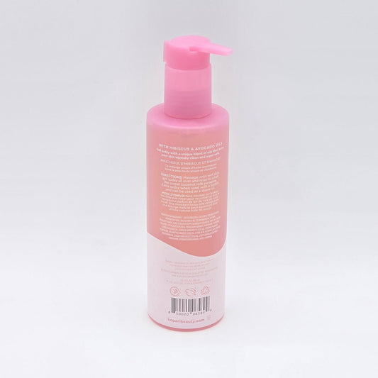 Pink Kopari Hydrating Vitamin C Shower Oil bottle with a self-foaming pump and white label.