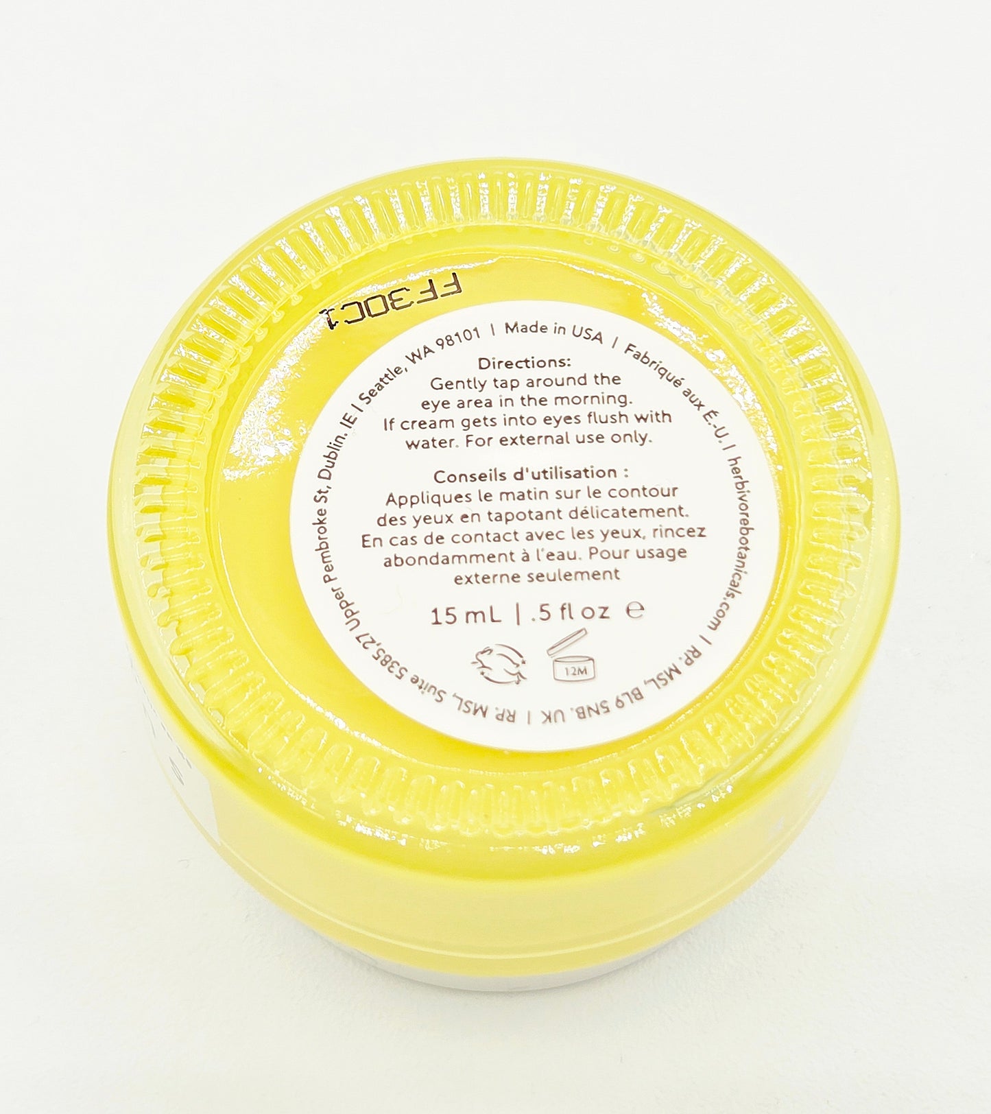 Yellow container with a label on a white background