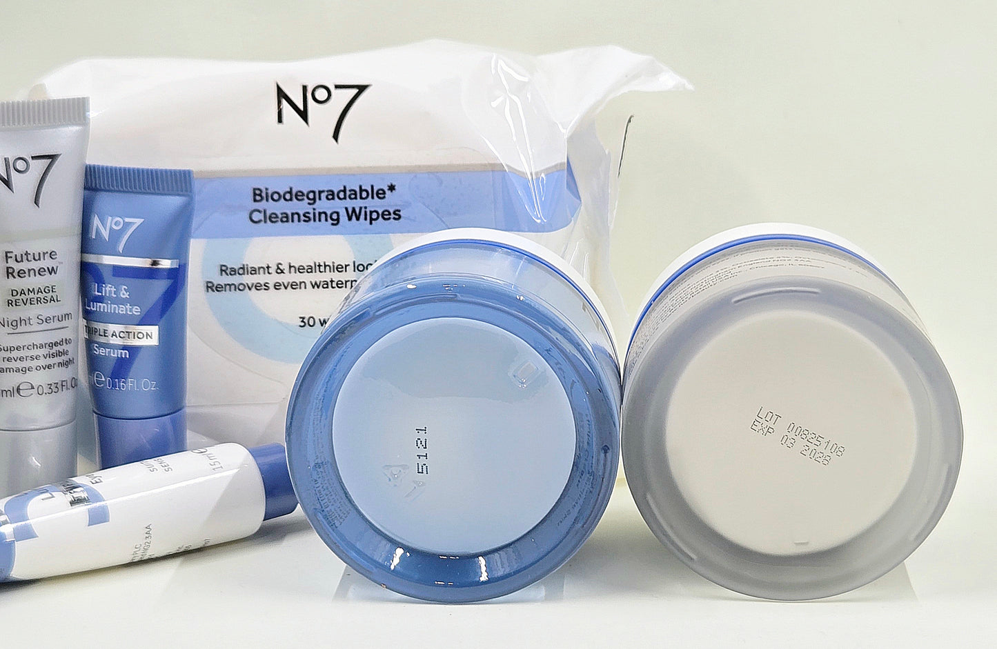 No7 skincare set packaging with Lift & Luminate creams, serums, eye cream, and cleansing wipes