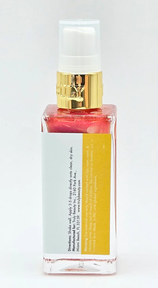 Red pump bottle with gold trim on white background