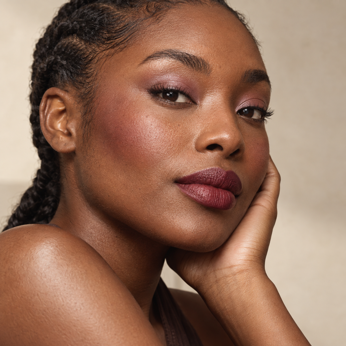 Beauty portrait with sheer mauve eyes, buildable berry cheeks and a full-pigment rose lip.