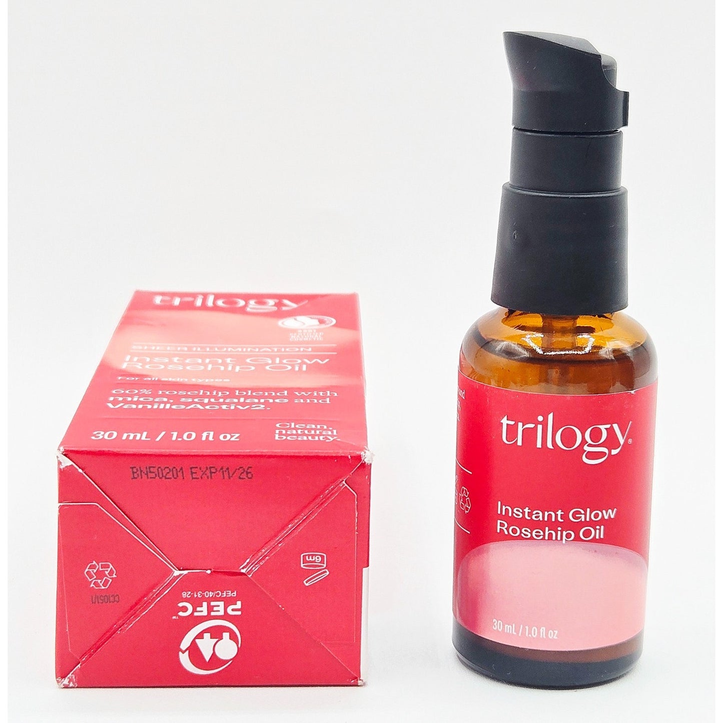 Trilogy Instant Glow Rosehip Oil bottle and packaging on a white background