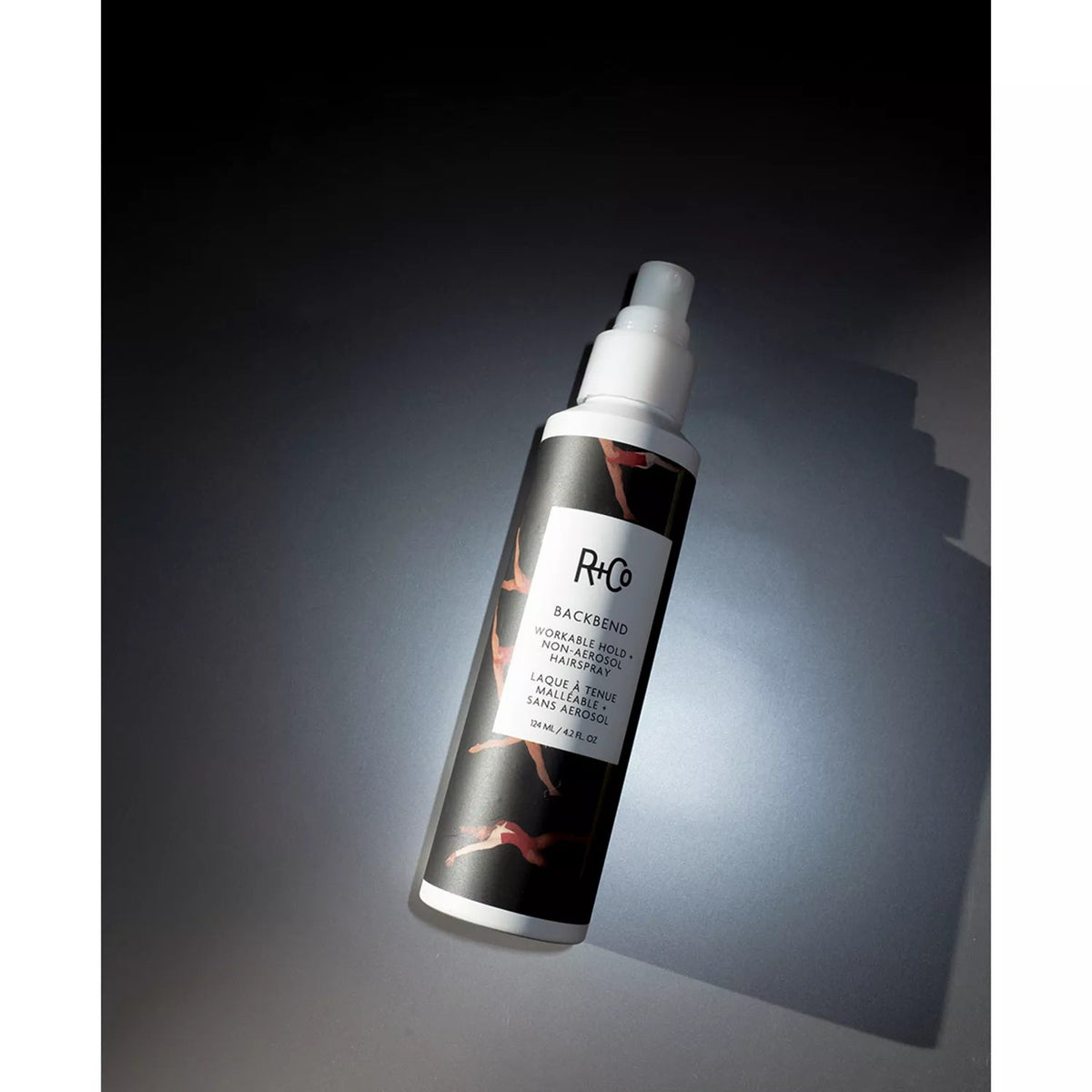 R+Co BACKBEND hairspray bottle photographed in directional light