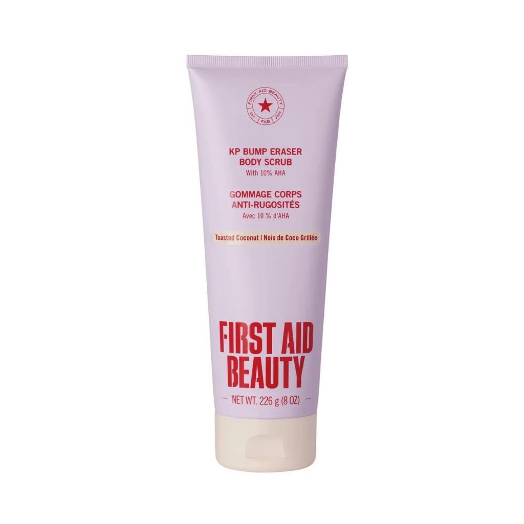 A tube of KP Bump Eraser Body Scrub by First Aid Beauty, featuring a pale lavender body with red text and a cream-colored cap, set against a plain white background.