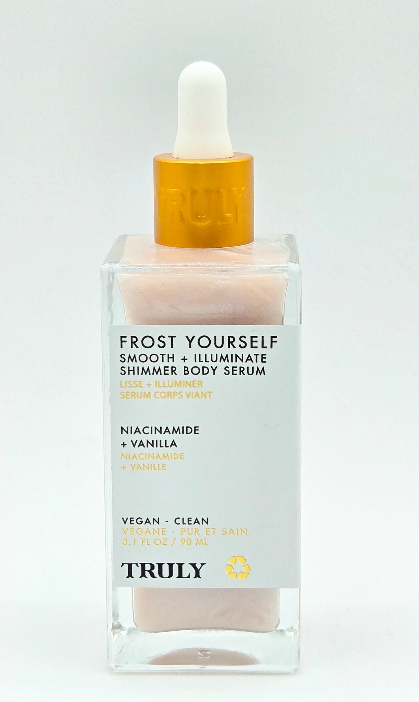 Body serum bottle with dropper labeled 'TRULY' on a light gray background