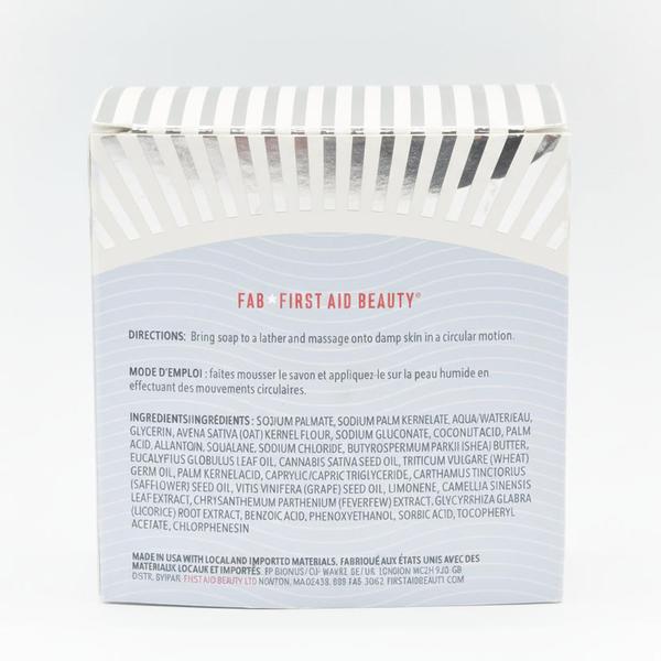 Back of a white First Aid Beauty body bar box with ingredient list and directions in English and French.