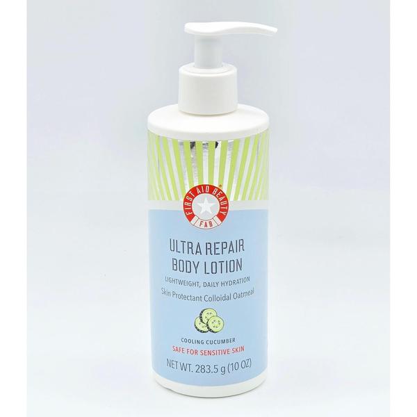 First Aid Beauty Ultra Repair Body Lotion, 10 oz, white pump bottle with green and blue label.