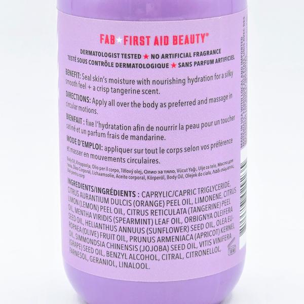 First Aid Beauty After Shower Nourishing Body Oil, purple bottle with product details.