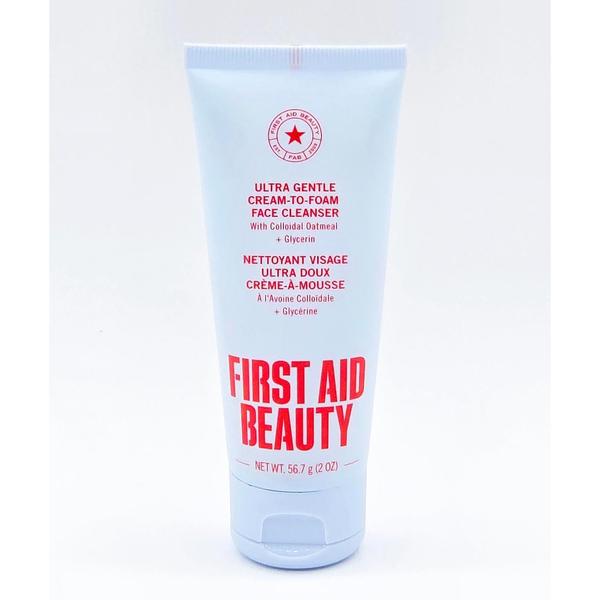 First Aid Beauty Ultra Gentle Cream-to-Foam Face Cleanser, 2 oz light blue tube with red text.