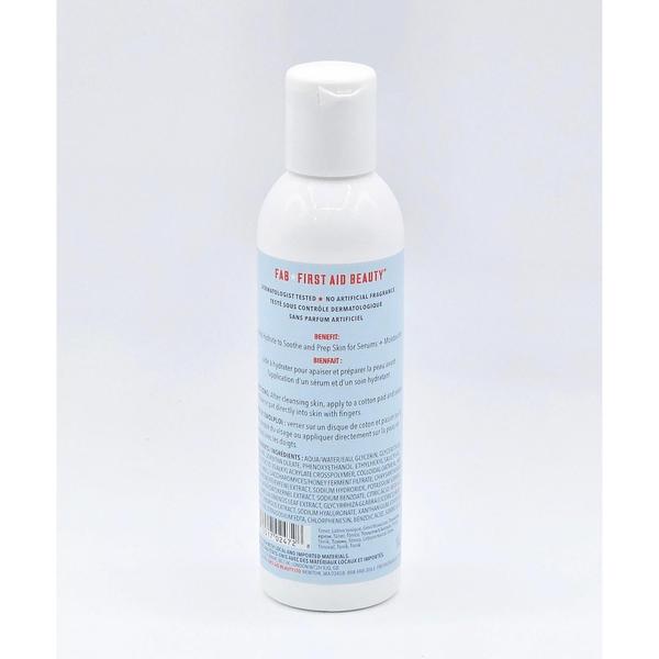 White First Aid Beauty Hydrating Toner bottle with blue label, visible ingredients list, and white flip-top cap.