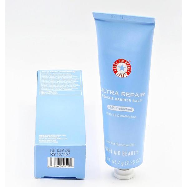 Light blue First Aid Beauty Ultra Repair Rescue Barrier Balm 2.25 oz tube and matching box with product details.