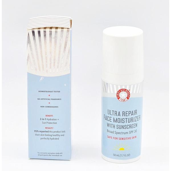 First Aid Beauty Ultra Repair Face Moisturizer SPF 30, white bottle with light blue label, next to its open box.