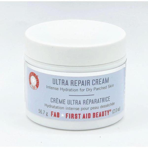 White jar of First Aid Beauty Ultra Repair Cream, 2 fl oz, with a light blue label.