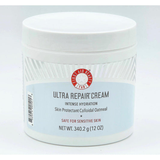 White First Aid Beauty Ultra Repair Cream 12 oz jar with red and blue label, "Safe for Sensitive Skin.
