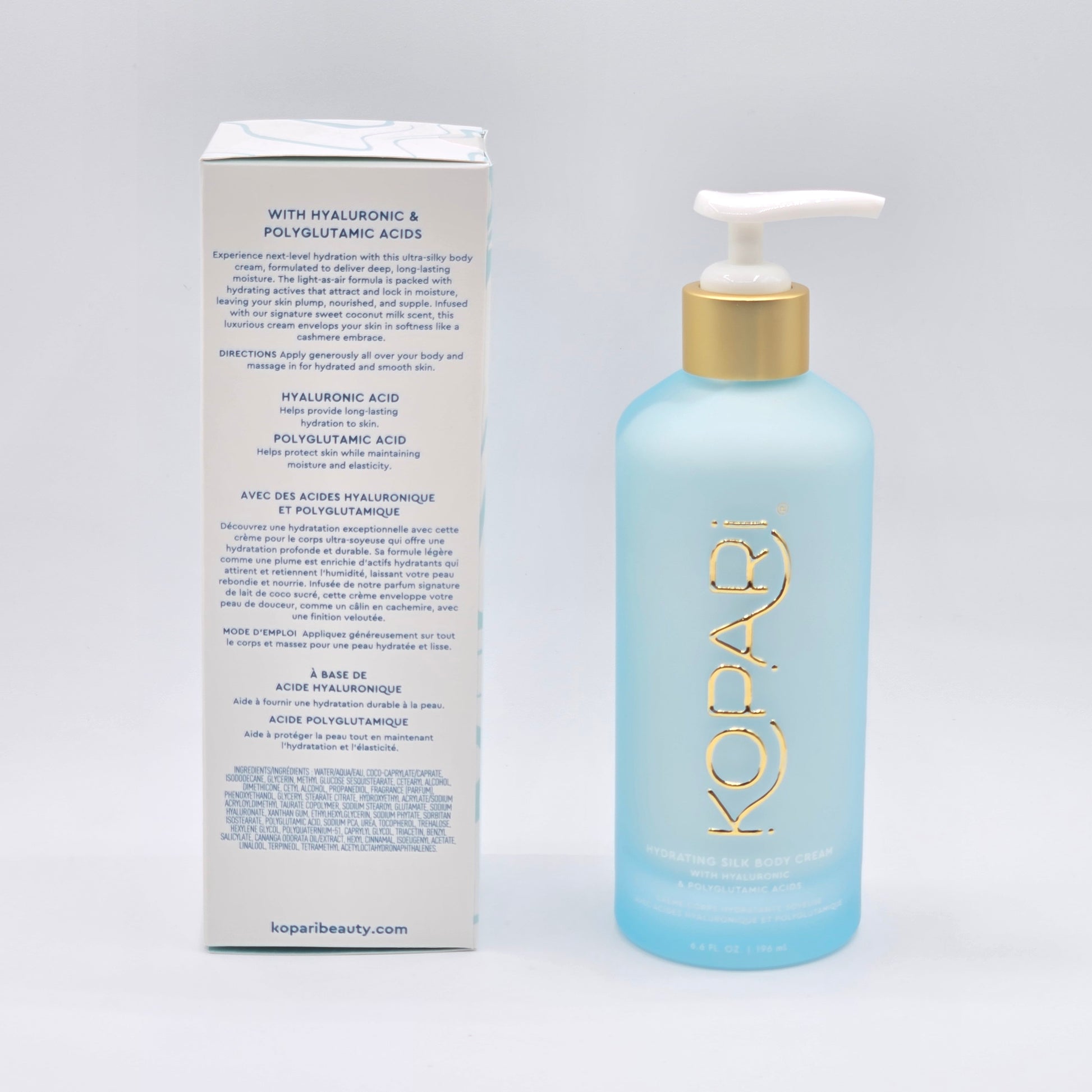 Kopari Hydrating Silk Body Cream, 6.6 fl oz, in a light blue pump bottle with a gold cap, next to its white box.