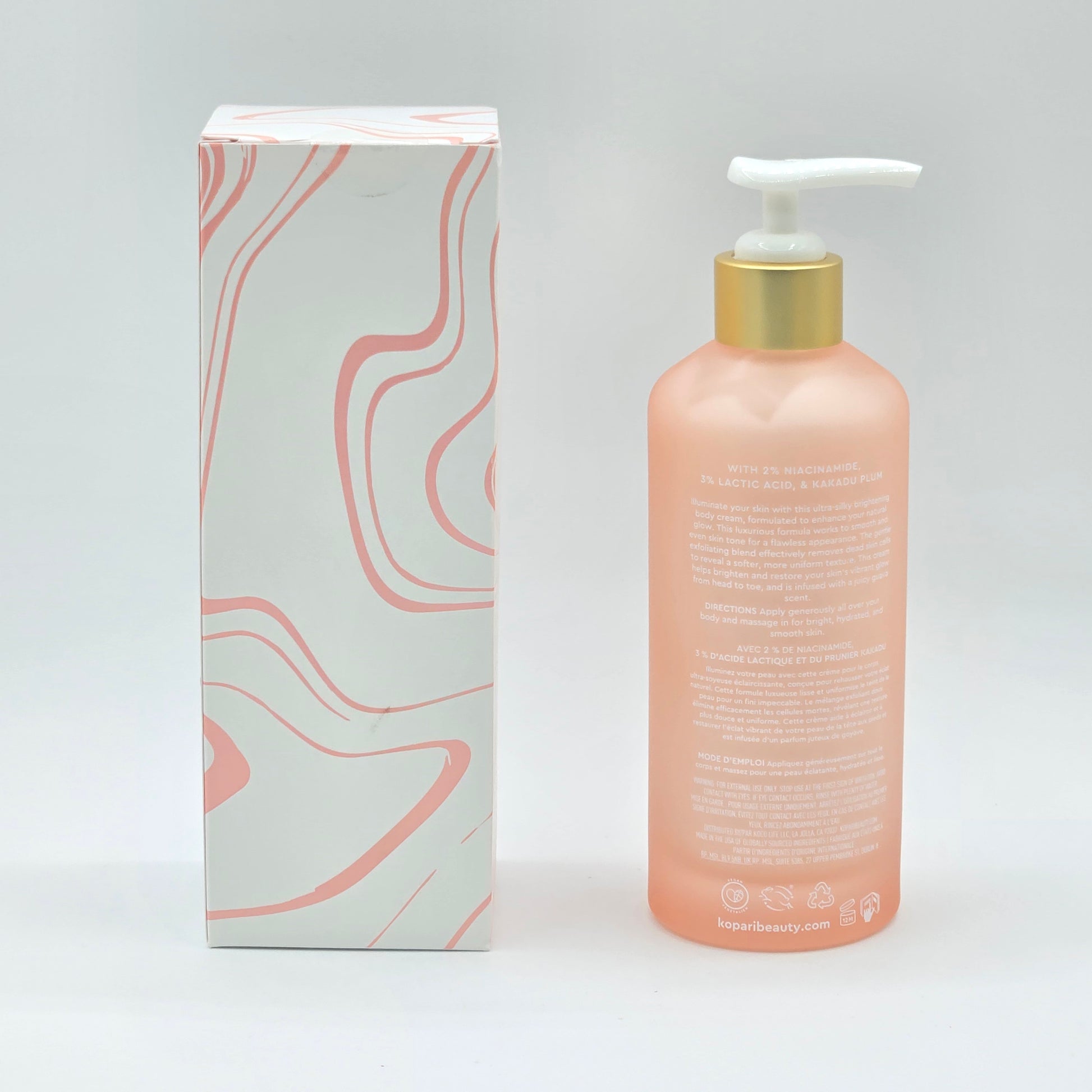 Kopari Brightening Silk Body Cream, 6.6 fl oz, in a peach pump bottle with a white and peach patterned box.
