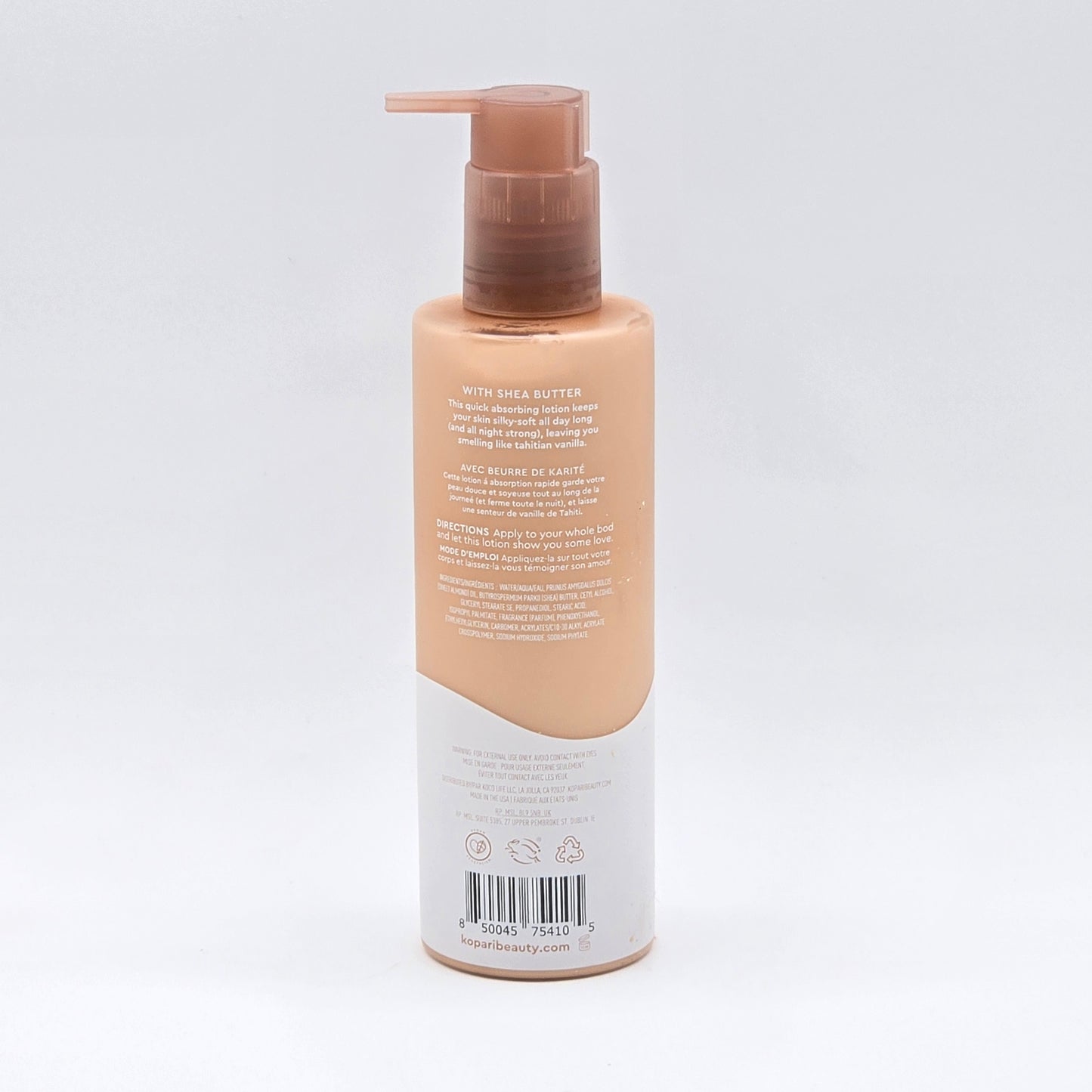 Kopari Tahitian Vanilla Hydrating Body Milk, 8.45 fl oz, in a peach pump bottle with white label.