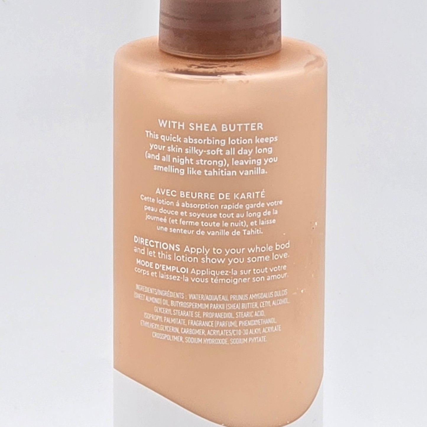 Kopari Tahitian Vanilla Hydrating Body Milk, 8.45 fl oz, light peach bottle with brown cap.