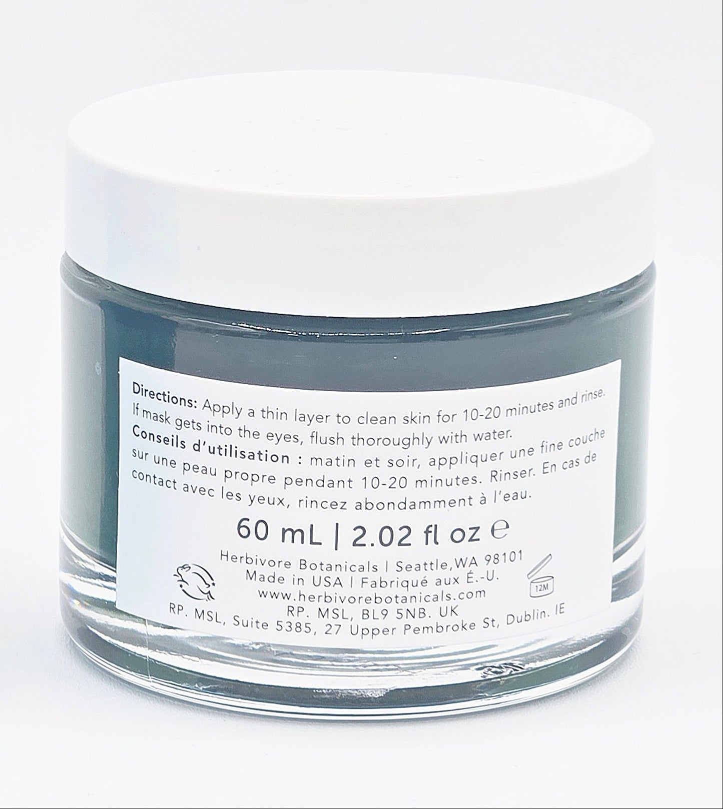 One blue skincare jar on a white background