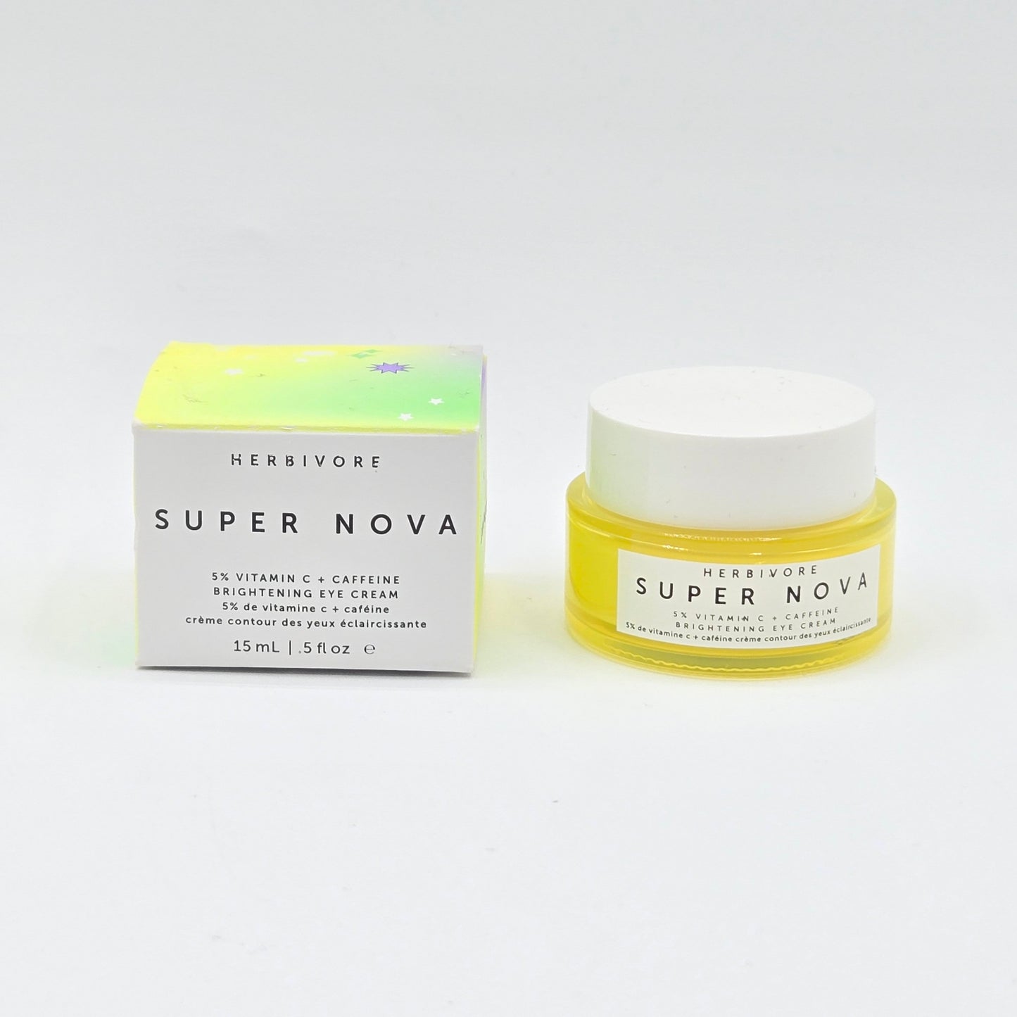 Herbivore Super Nova eye cream jar and box on a white background