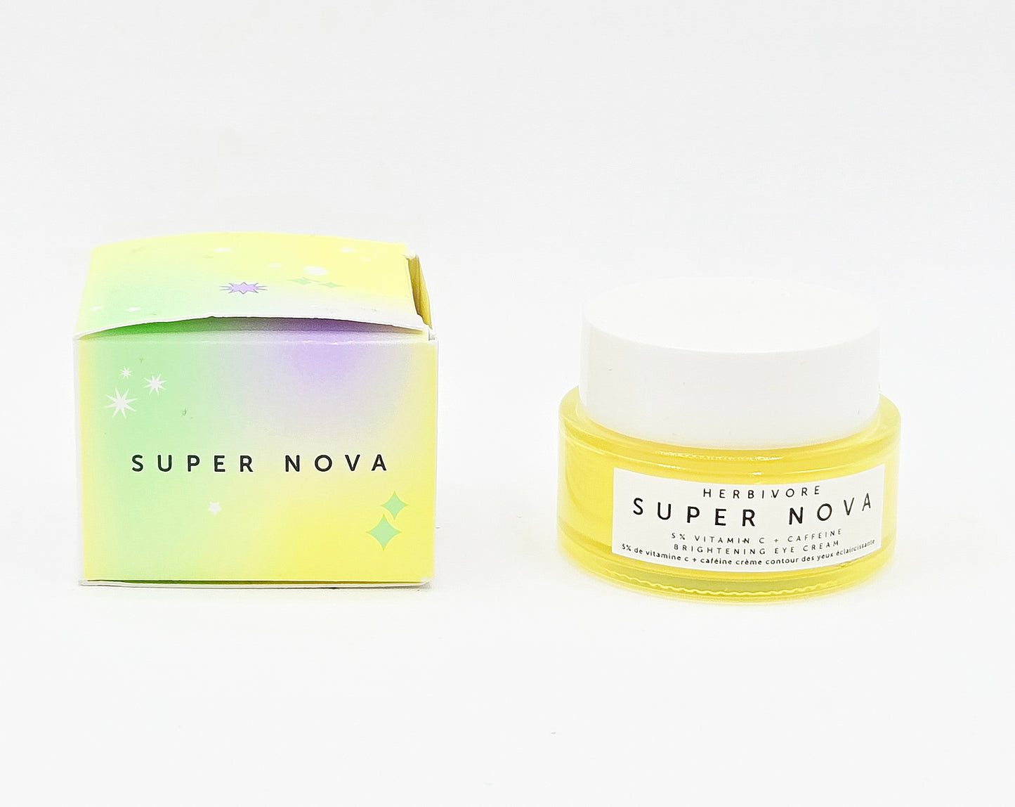 Two jars of Herbivore Super Nova eye cream on a white background