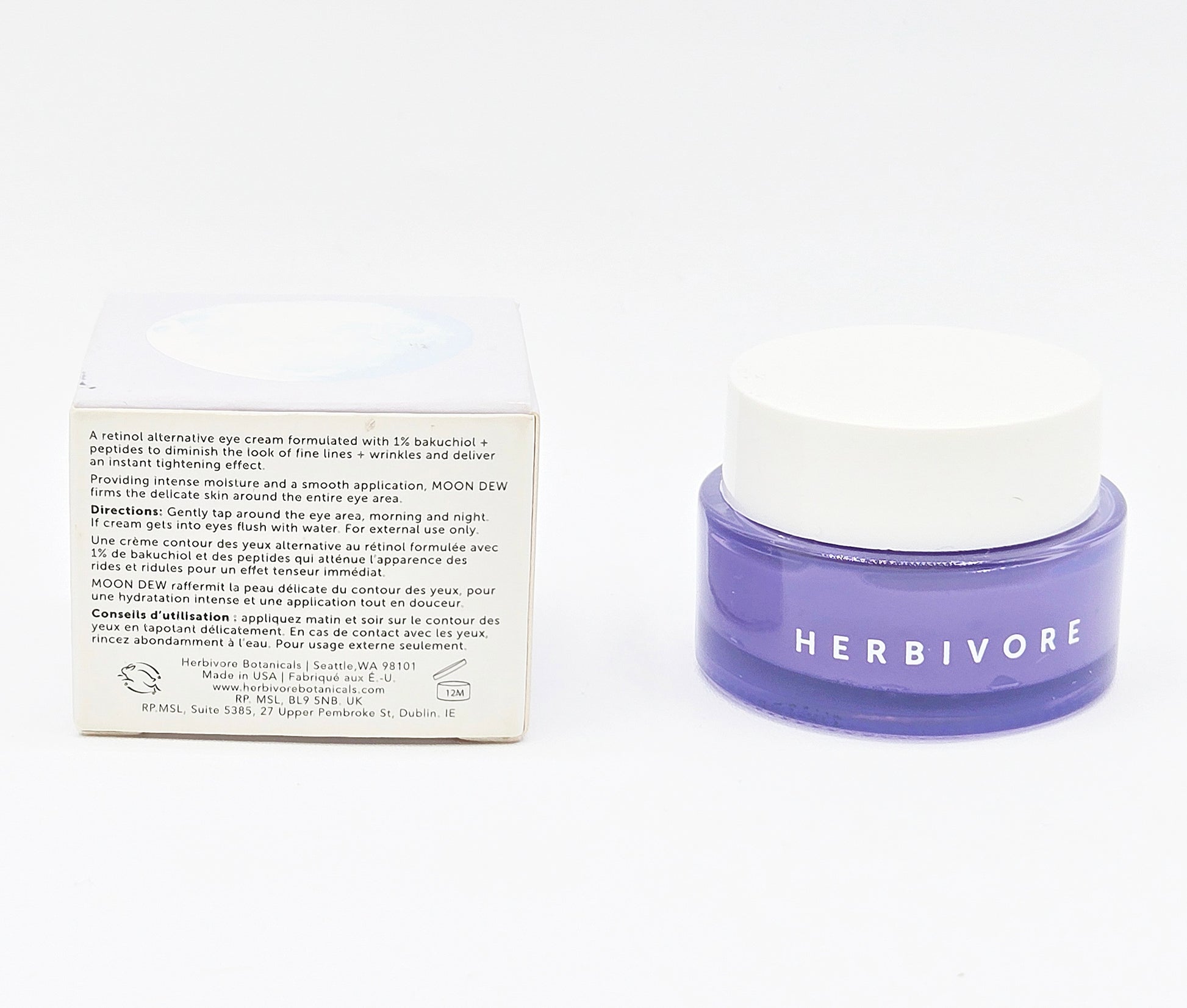Herbivore eye cream jar with packaging on a white background