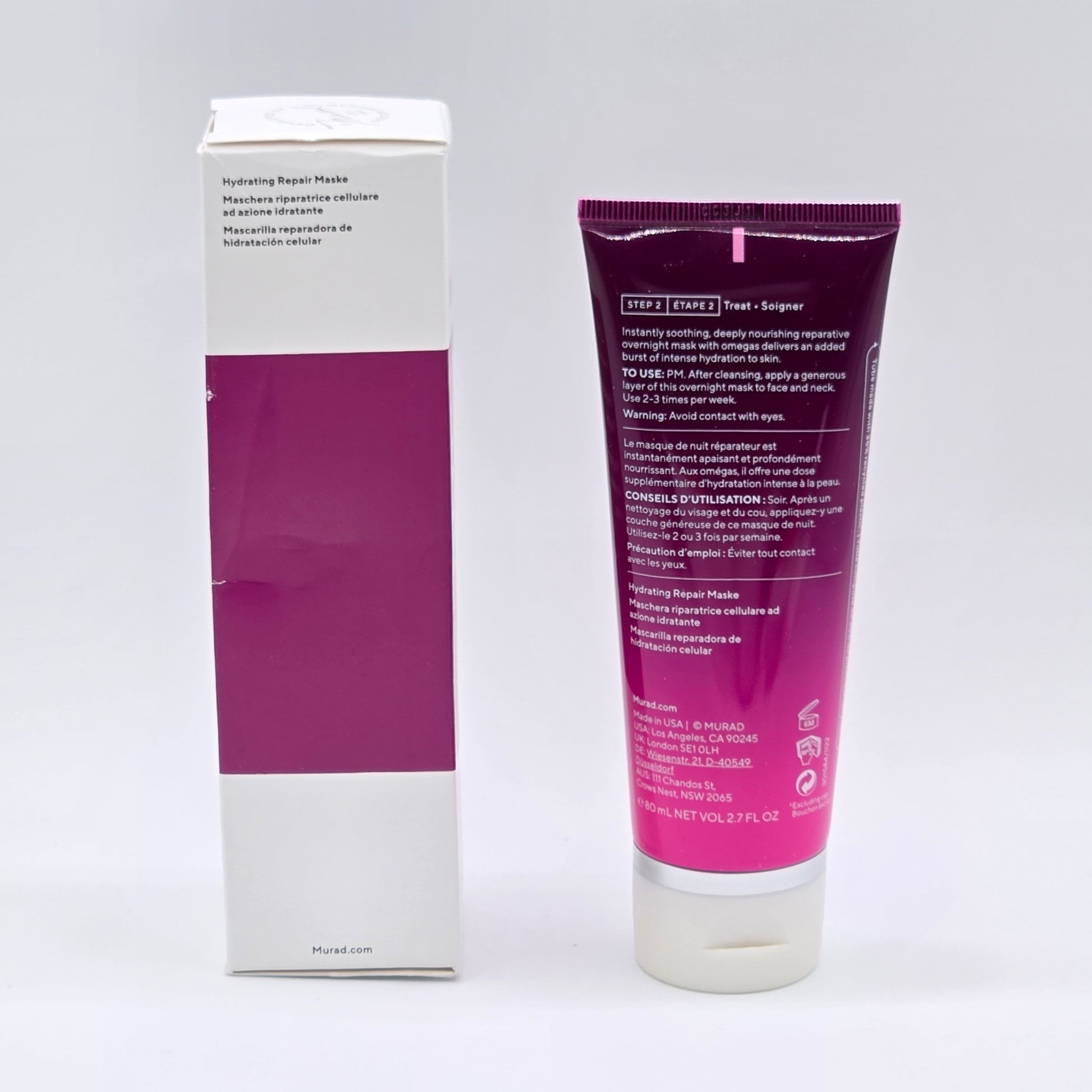 Purple tube and box of a skincare product on a white background