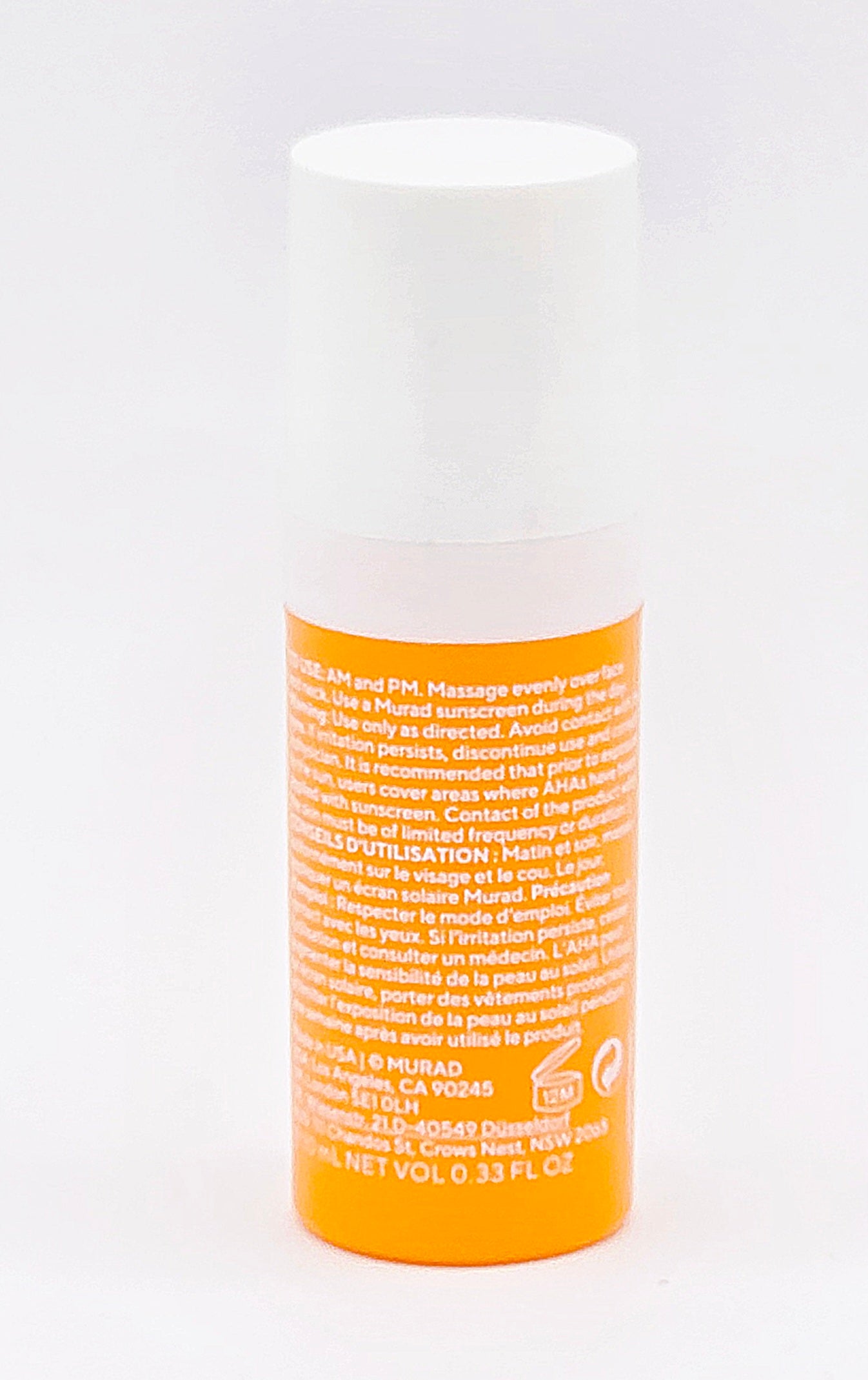 Glycolic Vit-C serum bottle with orange label on a white background