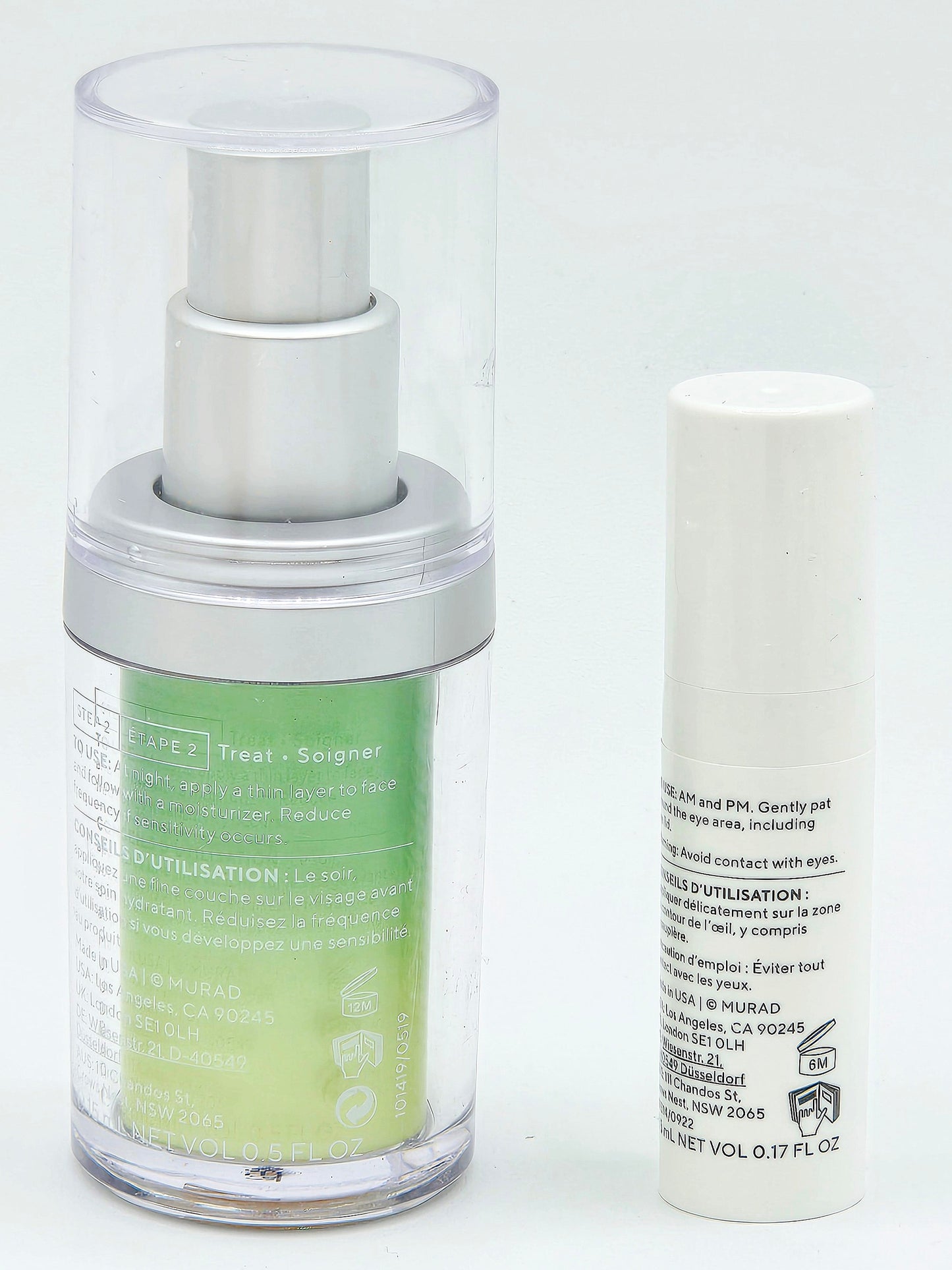 Skincare serum bottle with green liquid and white cap on a white background