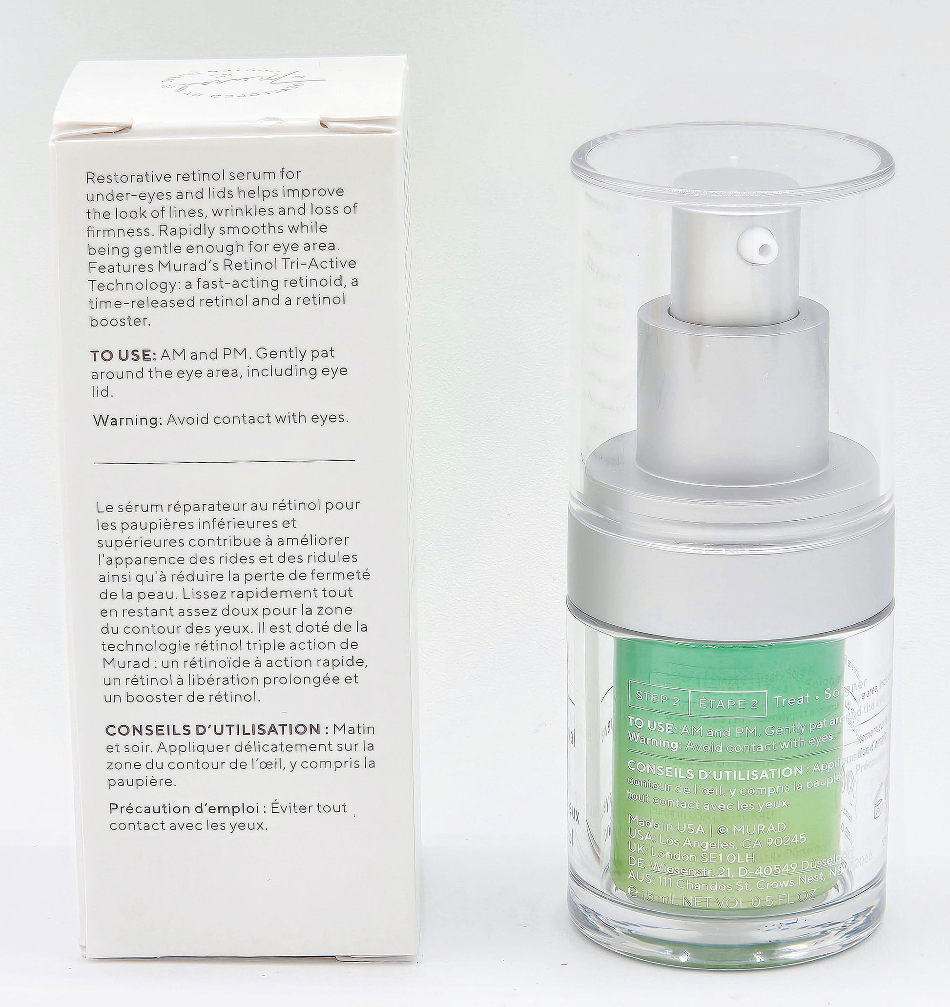 Skincare serum bottle with packaging on a white background