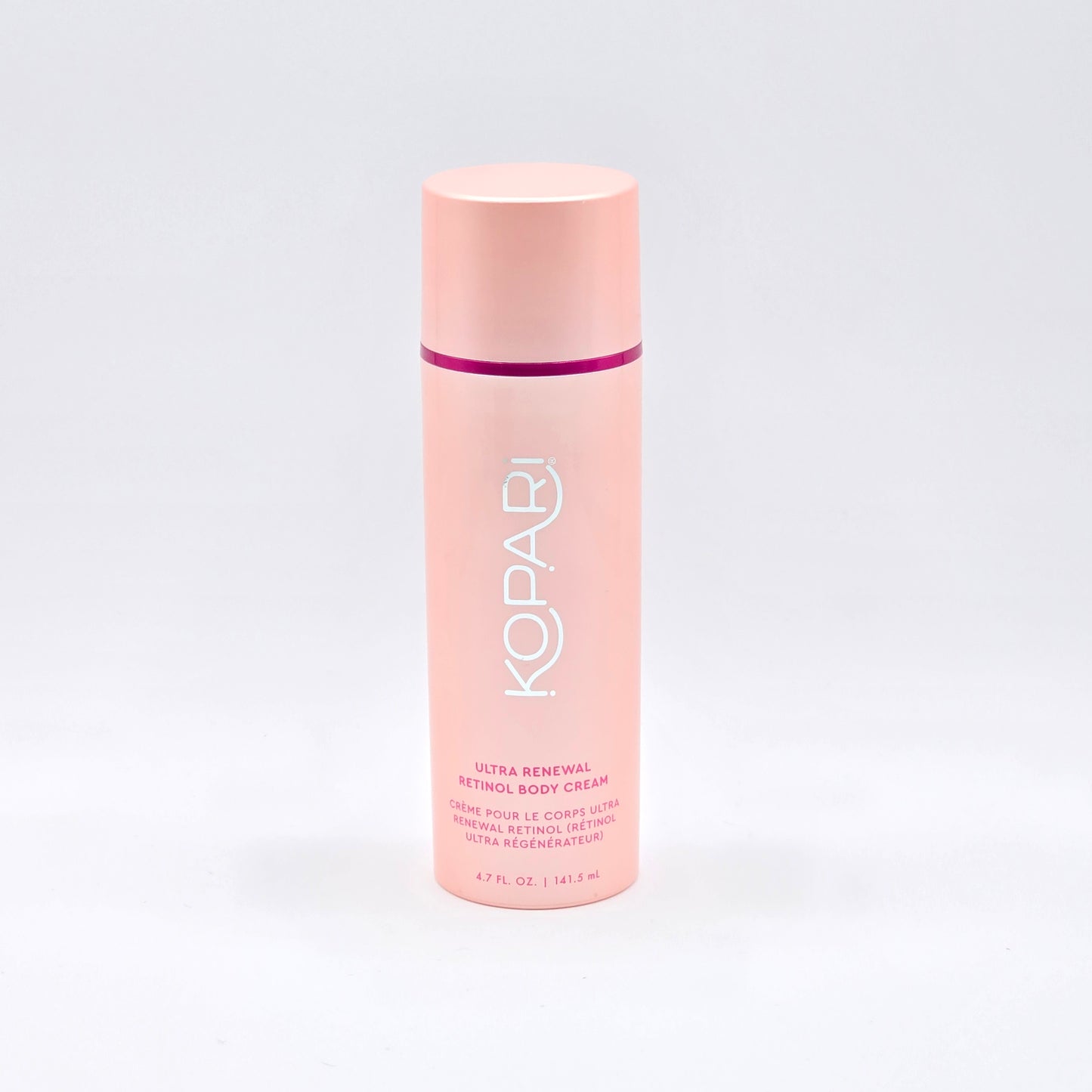 Kopari Ultra Renewal Retinol Body Cream, 4.7 fl oz, in a tall, light pink pump bottle with a darker pink band.