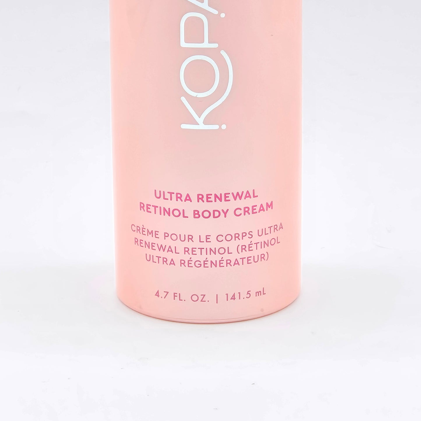 Kopari Ultra Renewal Retinol Body Cream, 4.7 fl oz, in a light pink bottle with white and red text.