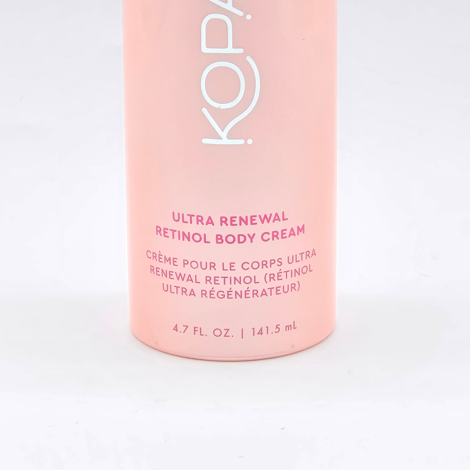 Kopari Ultra Renewal Retinol Body Cream, 4.7 fl oz, in a light pink bottle with white and red text.