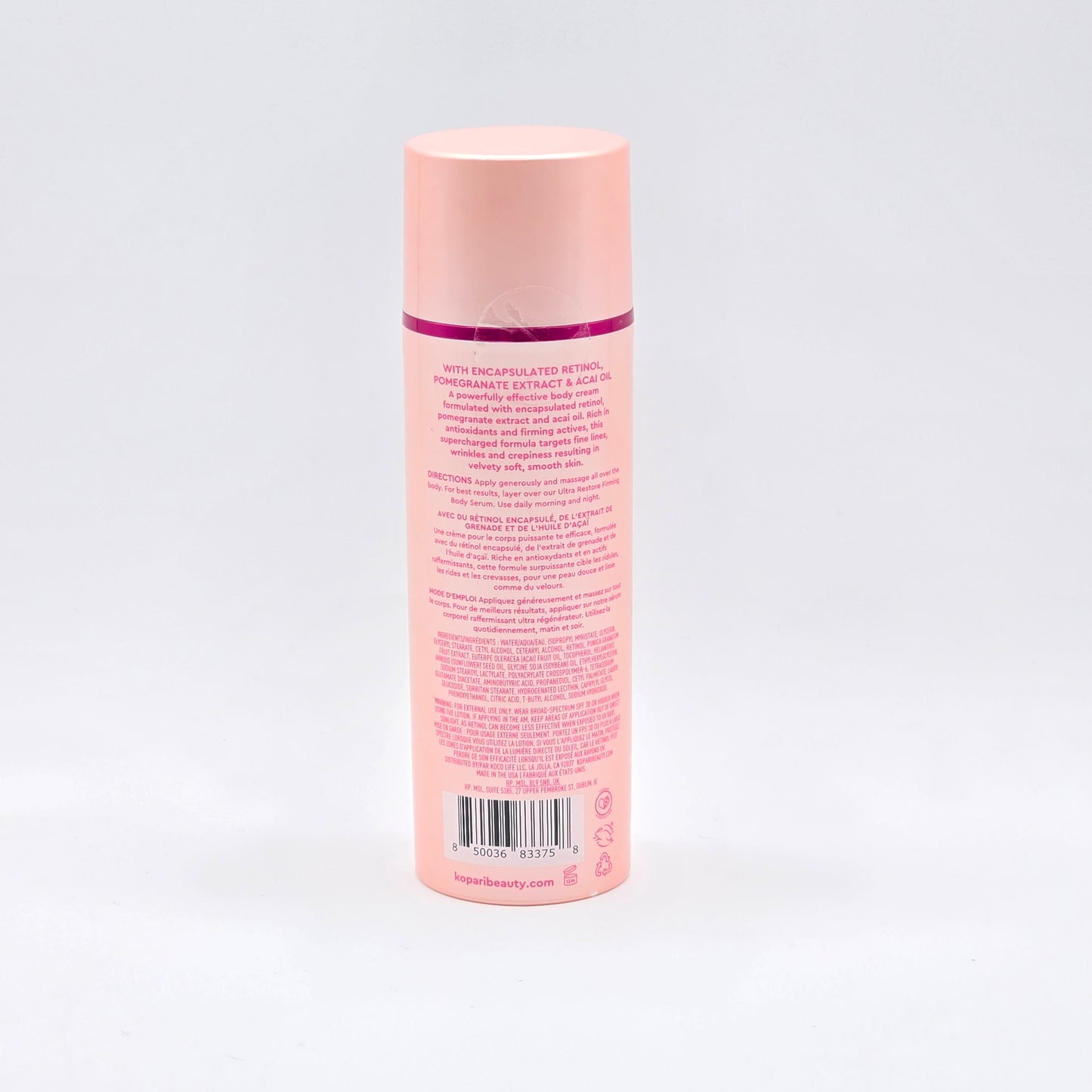 Kopari Ultra Renewal Retinol Body Cream, 4.7 fl oz, in a peach-colored bottle with a pink cap.