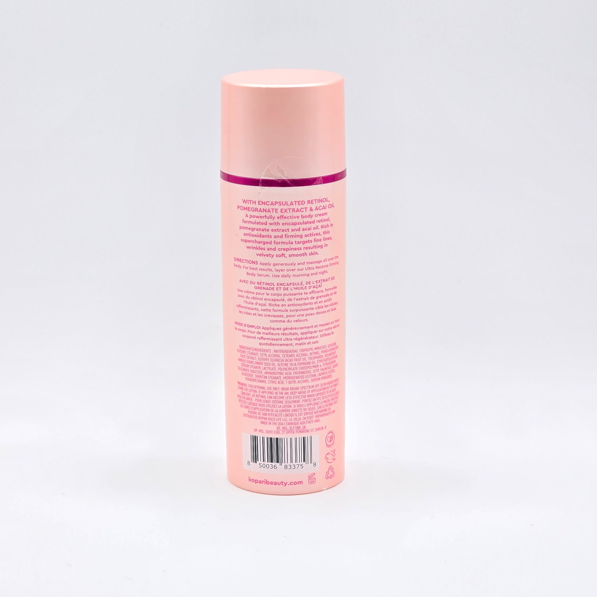Kopari Ultra Renewal Retinol Body Cream, 4.7 fl oz, in a peach-colored bottle with a pink cap.