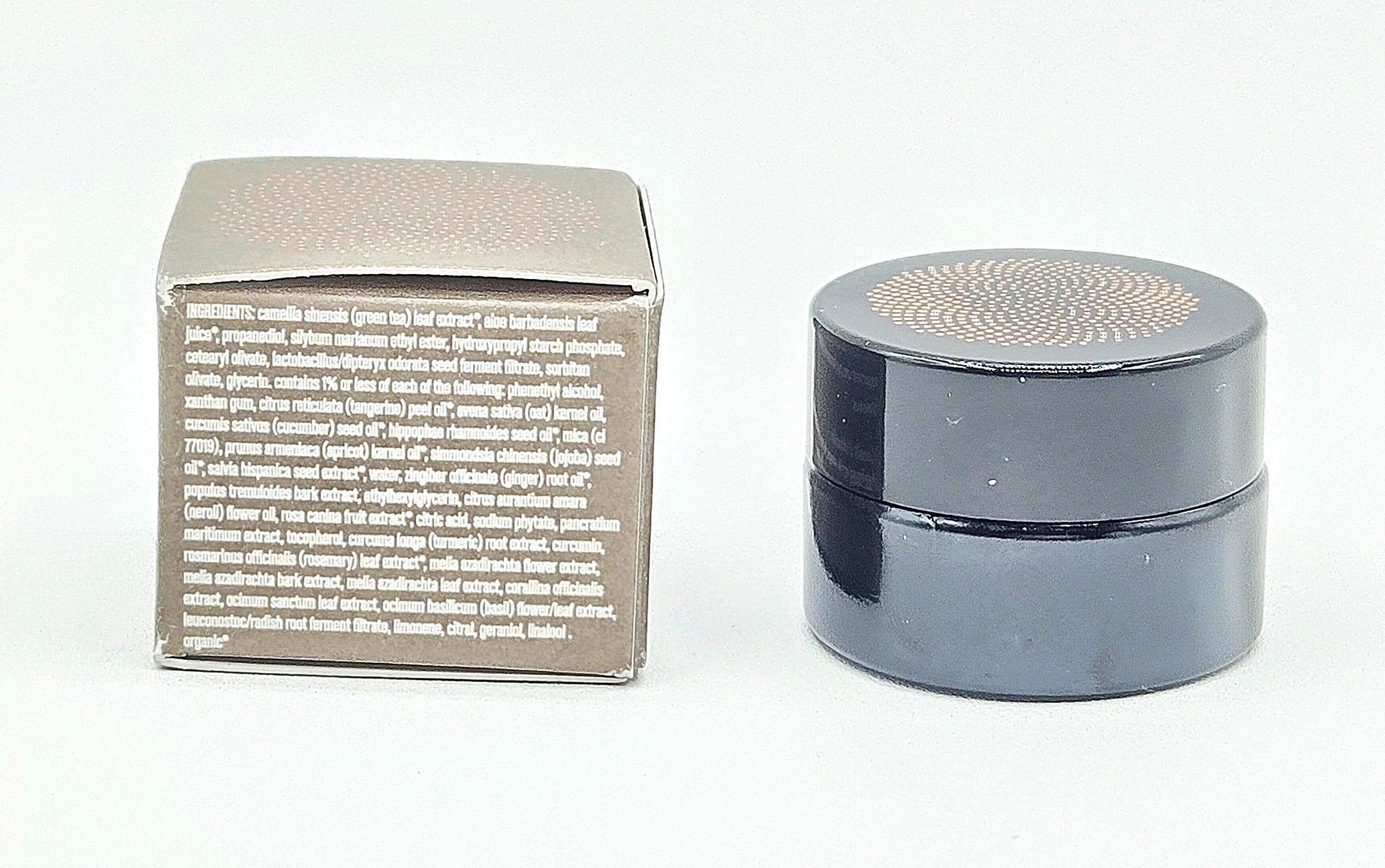 Silver square container with text and round black container on a white background