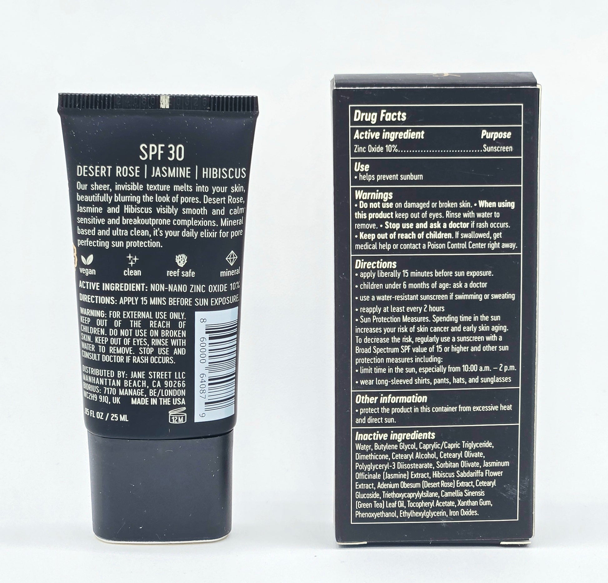 Back view of a sunscreen tube and its packaging with text details on a white background