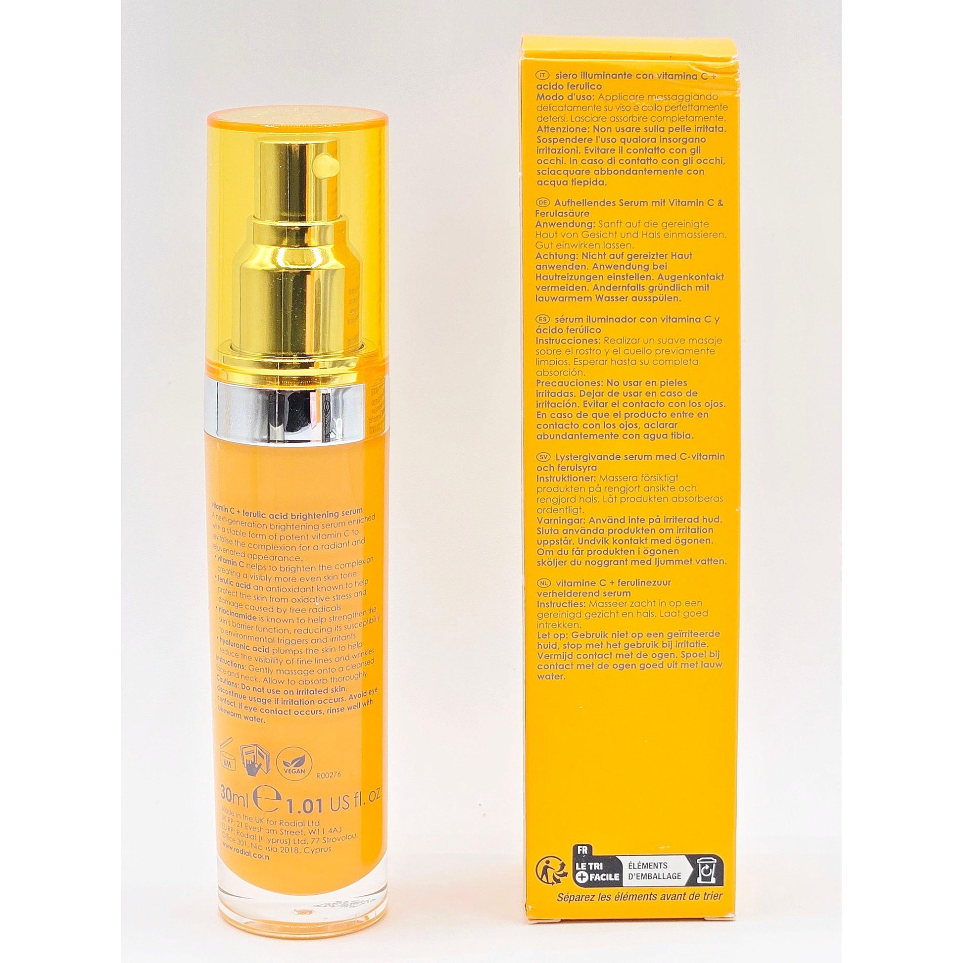 Skincare bottle with gold cap and packaging on a white background
