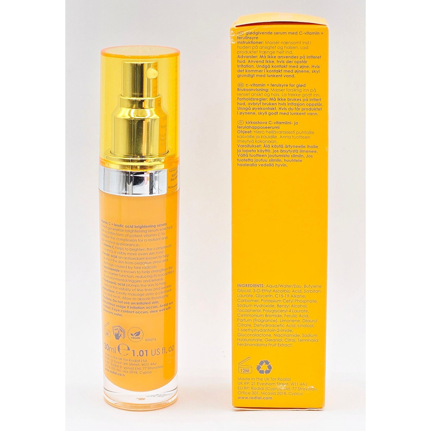 Yellow skincare bottle and packaging on a white background