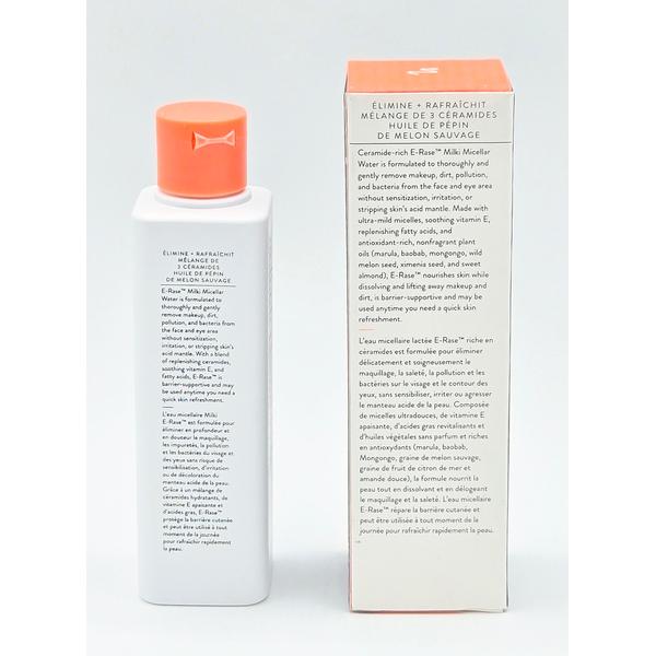 Drunk Elephant E-Rase Milki Micellar Water in a tall white bottle with an orange cap.