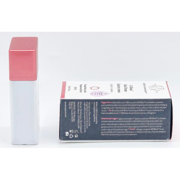 Drunk Elephant D-Bronzi Anti-Pollution Sunshine Drops, a white bottle with a rose gold cap, next to its box.