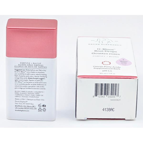 Drunk Elephant O-Bloos Rosi Drops, a pink liquid blush in a white bottle with a rose gold cap, next to its white and pink box.