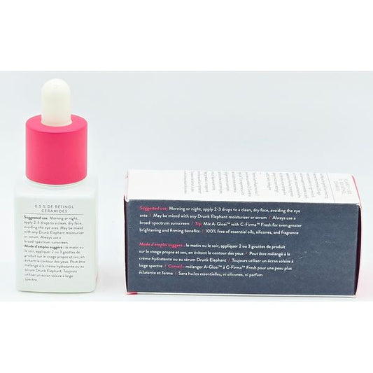 Drunk Elephant 0.5% Retinol Ceramides serum in a white dropper bottle with a pink cap, next to its product box.