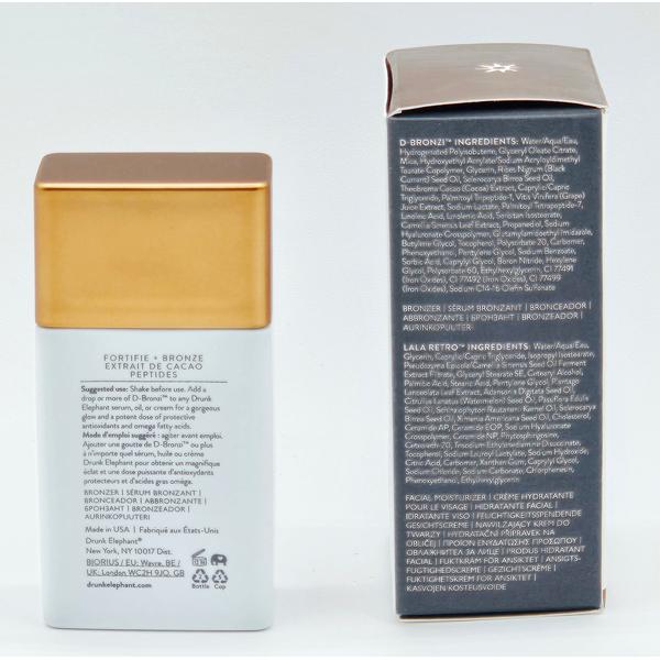 Drunk Elephant D-Bronzi Anti-Pollution Sunshine Drops, white bottle with gold cap, next to its black box with ingredients.