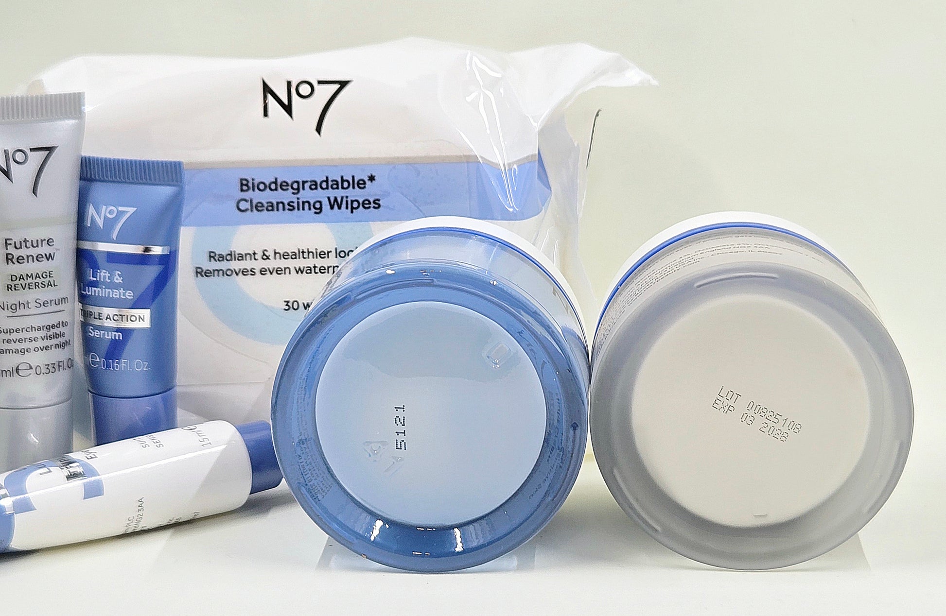 No7 skincare set packaging with Lift & Luminate creams, serums, eye cream, and cleansing wipes