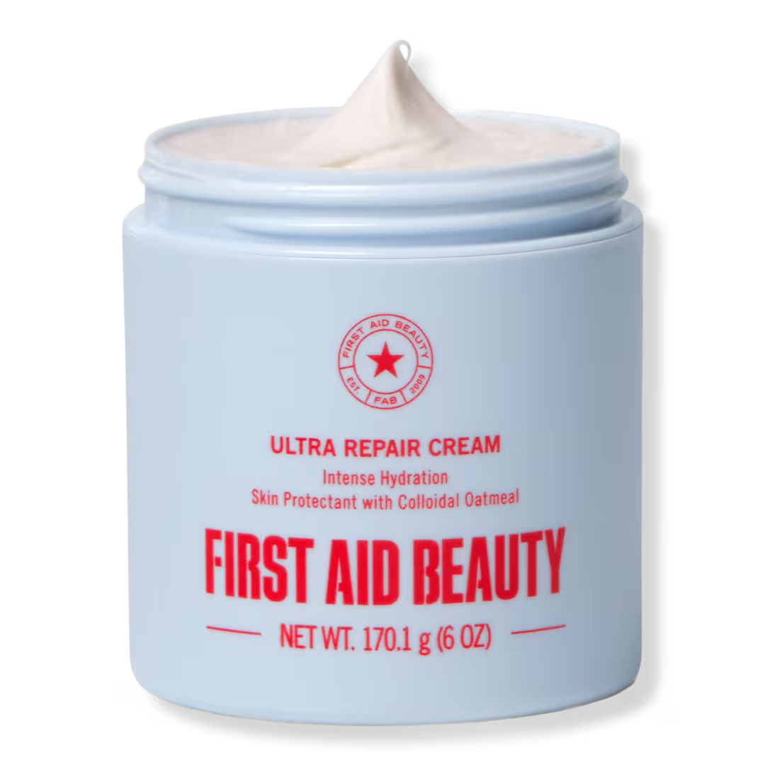 Open 6 oz / 170.1 g jar of First Aid Beauty Ultra Repair Cream, showing its whipped white texture.