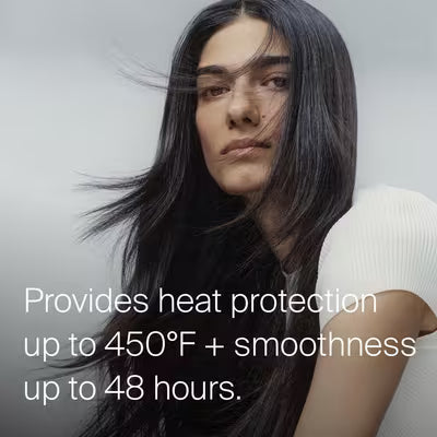 Model with long, smooth dark hair; Living Proof PhD Heat Styling Spray graphic states heat protection up to 450°F and smoothness up to 48 hours